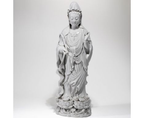 A CHINESE BLANC-DE-CHINE FIGURE OF GUANYIN； Please note: in-house shipping cannot be arranged for this item, bidders need to 