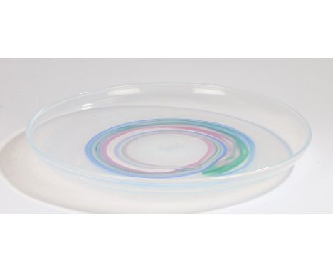 Hadeland glass dish, the opalescent ground with swirled puce blue and green decoration, signed to base, 41cm diameterLight su
