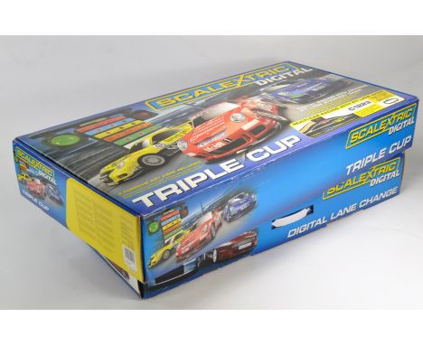 Scalextric Slot Car Set comprising Digital Triple Cup, contents still sealed, plus one other absent of cars. 