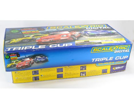 Scalextric Slot Car Set comprising Digital Triple Cup, looks to be complete and unused, plus one other absent of cars. 