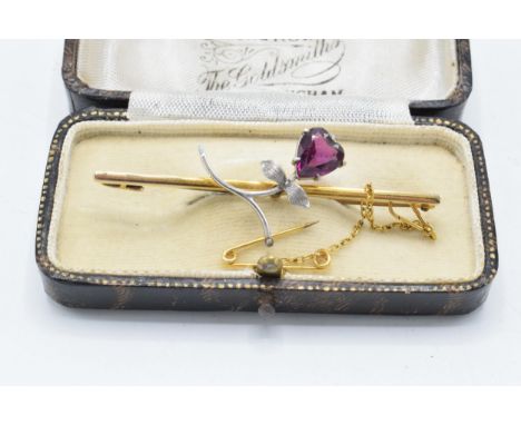 9ct gold and white metal sweetheart brooch set with amethyst stone and gold safety chain. Gross weight 4.4 grams. 6cm wide.  