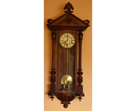 A late 19th century ornate Vienna wall clock with pendulum and weights. 128cm tall.  Untested though physically it is in good