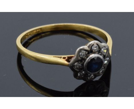 18ct gold and platinum daisy ring set with sapphire and diamonds. 2.1 grams. Size R/S.  