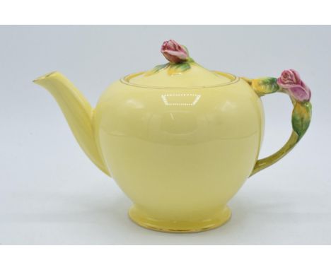 Royal Winton rose bud yellow teapot with pink rose finial to lid. 15cm tall.  In good condition with no obvious damage or res