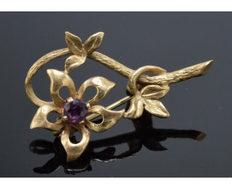 9ct gold brooch in the form of a blooming flower set with amethyst stone. 1.7 grams.  