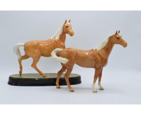 A pair of Beswick palomino horses to include Swishtail 1182 and a similar item on ceramic base (2) (both slight af).  Both di