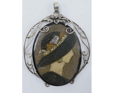 A silver mounted mosaic-style portrait pendant, 8.5cm tall.  Minor damage to right hand side of portrait.