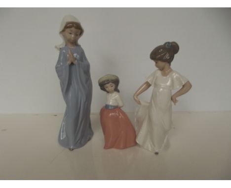 Three Nao figures of girls, largest 28cm 