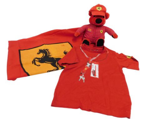 Ferrari collectables, comprising a child's T shirt, in key design, size 8 years, a Rosso red Teddy bear, Ferrari flag, and a 