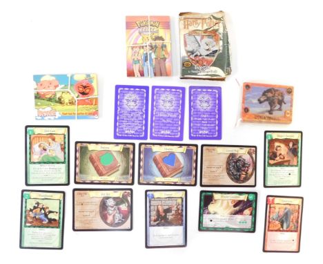 Various trading cards, including Harry Potter Trading game cards, Walking with Beasts, and twelve Pokemon Topps trading cards