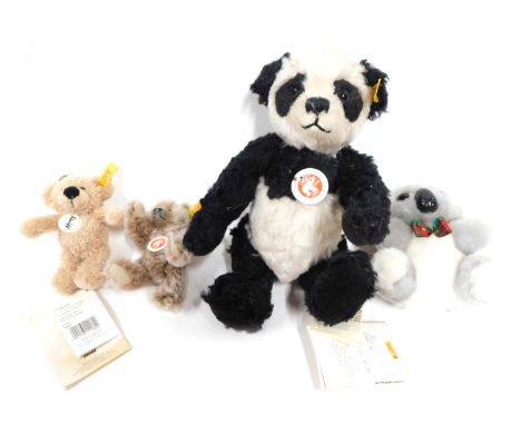 A Steiff mohair Classic Teddy Bear Panda, 26cm high, Steiff Teddy Bear Finn key ring, 12cm, a koala key ring, and another. (4