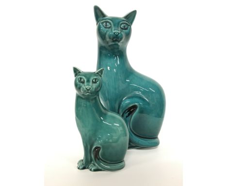 An early Poole Pottery blue glazed large Cat figure (12 inches) together with another (6 inches).