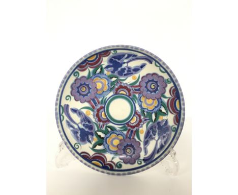 A Poole Pottery red bodied traditional footed bowl, decorated in the PB design by Vera Bridle (9 inches).
