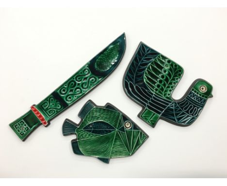 A Poole Pottery earthenware Robert Jefferson design wall plaque in the form of a Fish together with a Bird and a Dagger.