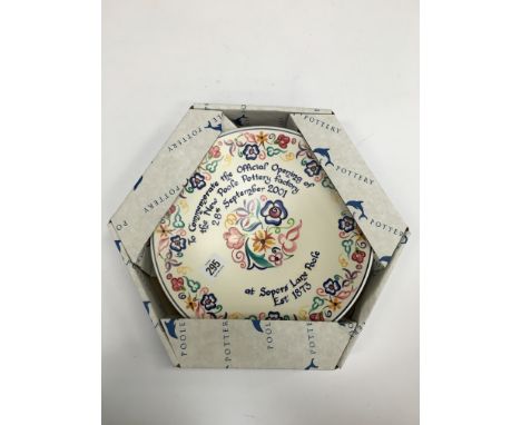 A Poole Pottery earthenware traditional dish, the design to Commemorate the opening of The Sopers Lane Factory 2001, boxed (1