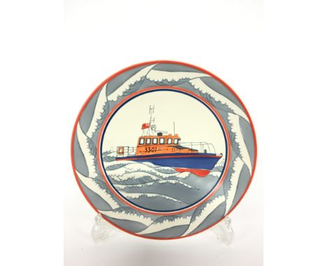 A Poole Pottery Studio dish, depicting a Lifeboat, designed and painted by Sue Pottinger (10 inches).