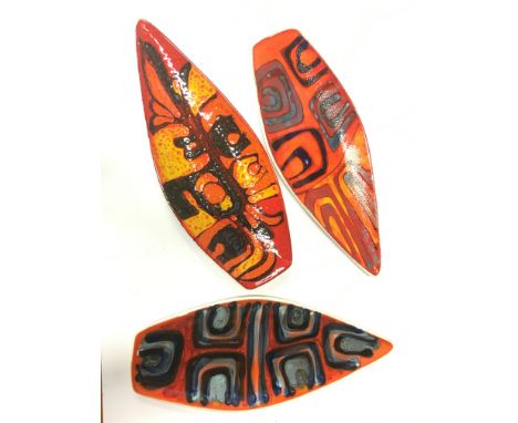 A Poole Pottery Delphis earthenware spear dish, shape 82 by Carole Holden (17 inches) together with two others.
