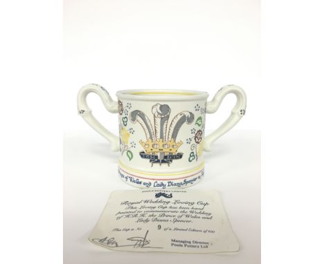 A Poole Pottery earthenware twin handled loving cup.  Commemorative for the Marriage of Prince Charles & Lady Diana, No. 9 of