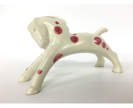 A Poole Pottery earthenware figure of a Rocking Horse, circa 1920's, designed by John Adams with spot decoration by Vera Brid