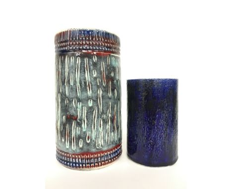 A Poole Pottery Delphis cylinder vase, shape 84, carved and glazed (10 inches high) together with another similar (6 inches).