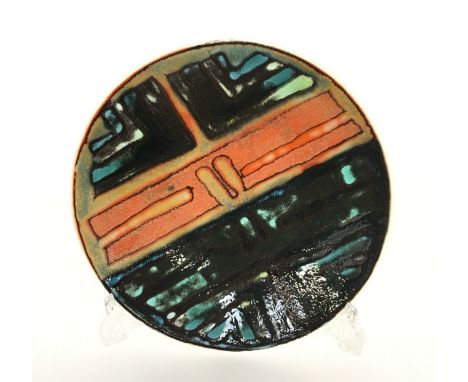 A Poole Pottery Delphis dish, shape 4, in an abstract design in early textured glazes by Geraldine O'Meara, blue backstamp (1