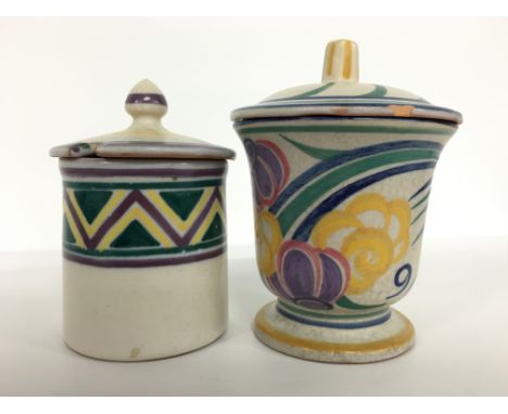 A Carter Stabler Adams Poole Pottery red bodied preserve pot and cover, decorated in an early YV design, circa 1920's by Anne