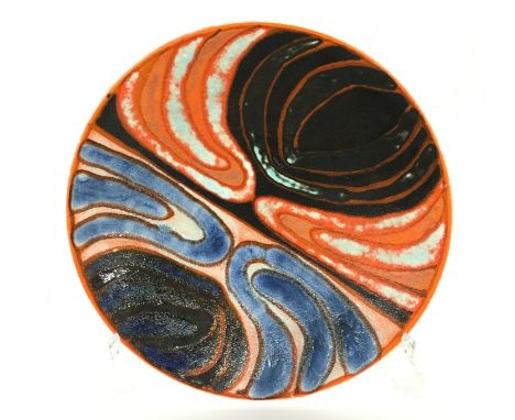 A Poole Pottery Delphis dish, shape 4, in an abstract design in early textured glazes by Geraldine O'Meara, blue backstamp (1