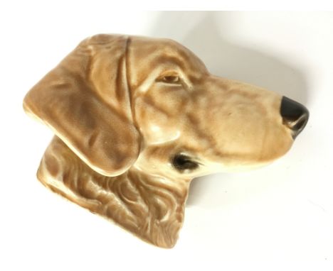 A Poole Pottery earthenware figure of a Labrador, circa 1930's, designed by John Adams in Picotee spray glaze.