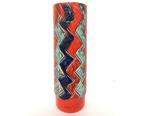 An early Poole Pottery earthenware vase, shape 85, carved and glazed in an early palette by Jean Millership (16 inches).