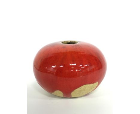 A Poole Pottery stoneware Atlantis style desk pebble by Guy Sydenham, decorated in a Lava Drip glaze (3 inches high).