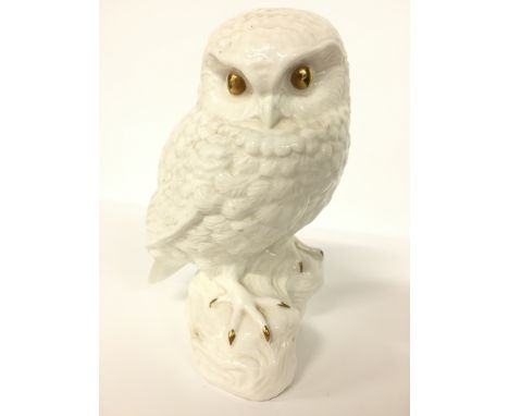 A Poole Pottery fine bone china Barbara Linley Adams figure of a Little Owl with gold lustre highlights (7 inches).