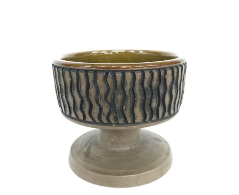 A Poole Pottery stoneware double ended candlestick, carved and glazed (5 inches high).