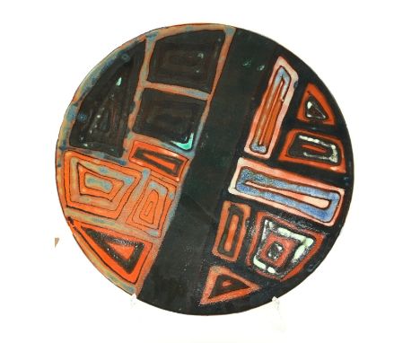 A Poole Pottery Delphis dish, shape 54, in an Abstract design in early textured glazes, painted by Geraldine O'Meara, blue ba