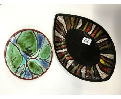 A Poole Pottery Delphis oval dish, shape 91, in an Abstract design in early textured glazes on a black ground, painted by Ang