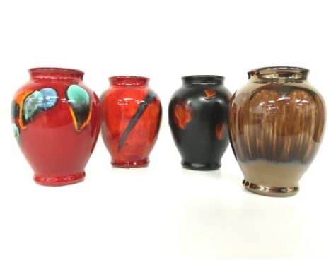 Four Poole Pottery Living Glaze miniature vases, decorated in the Peacock, Odyssey, Precious and Galaxy designs (4 inches).