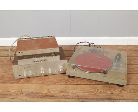 A Pioneer PL-512 turntable with a Leak Delia FM Tuner and a Rotel Stereo Intergrated Amplifier.  Turntable not working. Leak 