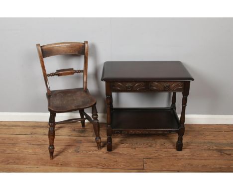 A 19th Century Elm Chair and a carved mahogany Side Table, dark wood with lower under tier shelf.  Table height 72cm width 53