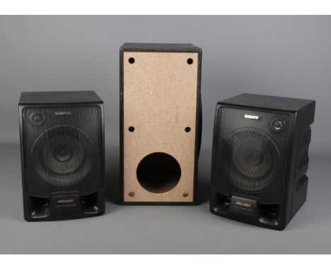 A pair of Sony mega bass speakers, along with an LG speaker. LG model SH85PH-W.