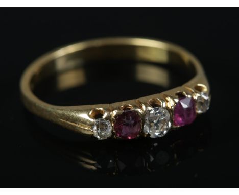 An 18ct Gold Ruby and Diamond five stone ring. Size M½. Total weight: 2.11g.