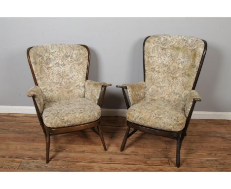 Pair of Ercol "Cushio" Design High Back Easy Chair, with detachable floral deep button fabric back and seat cushion, one slig