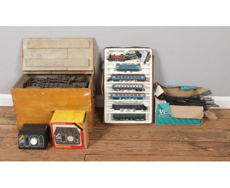 A collection of model railway, to include track, control units and Lima and Hornby engines and carriages etc.