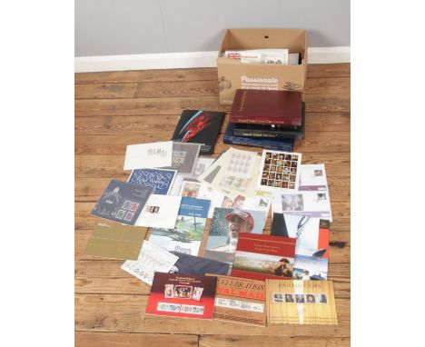 A box of assorted stamps and first day covers to include used, unused and presentation pack issues. Examples include limited 
