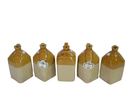 A group of four square stoneware spirit bottles with diamond registered marks impressed: Irish Whisky, Scotch Whisky, Brandy 