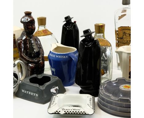 A quantity of brewery jugs and bottles, including Black &amp; White Whisky dogs jug and ash tray, a boxed Bell's Celebration 