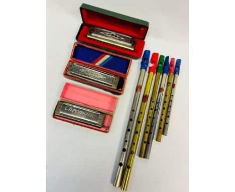 Two M. Honer harmonica’s and a Koch Harmonica together with a collection of tin whistles