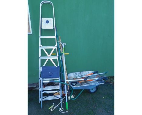 A wheelbarrow and contents of garden hand tools, together with step ladder, and further garden tools. (a quantity)