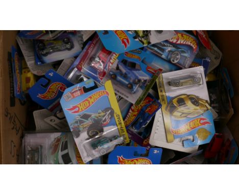 Hot Wheels, A collection of factory sealed 1:64 scale vehicles, 2000s, including private, competition and commercial models, 