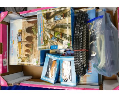 A collection of Hornby the world of Thomas the Tank Engine boxed items: to include Thomas clockwork set, percy clockwork set,