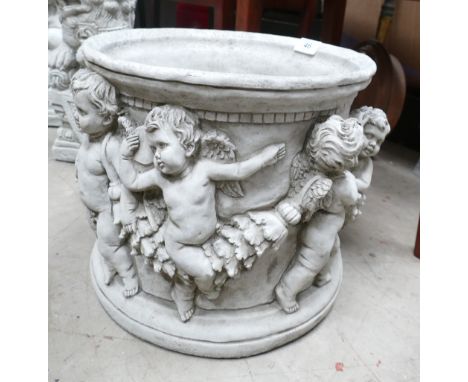Garden Ornament in the form of large planter decorated with cherubs  , height 33cm