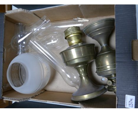 2 brass oil lamps together with glass shade; together with 4 oil lamp glass funnels
